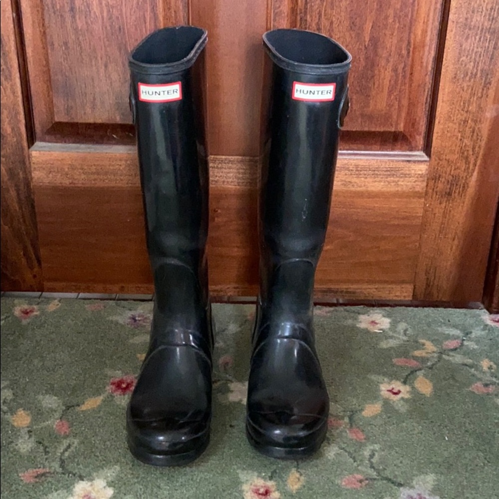 Tall black hunter boots